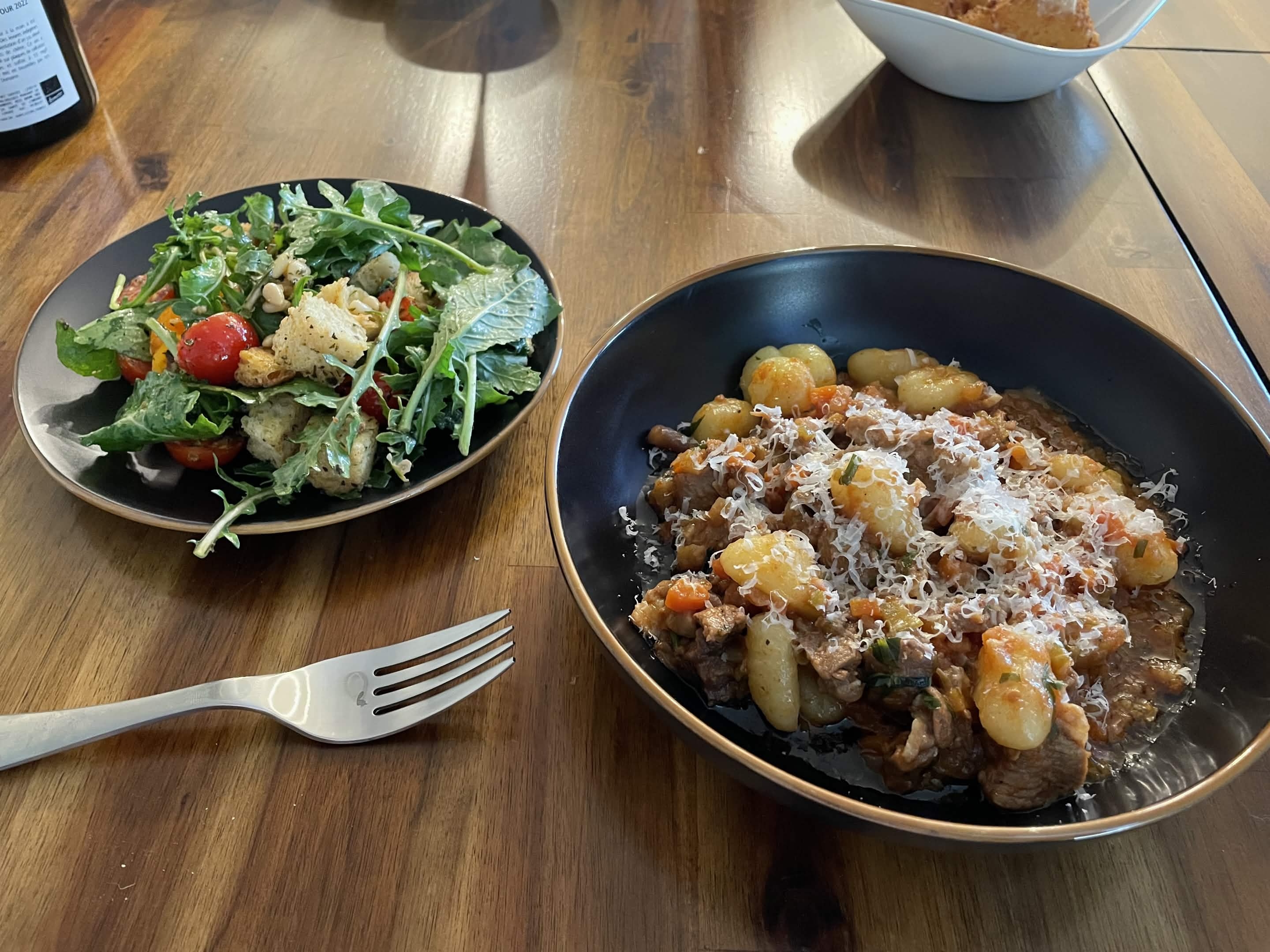 Duck ragu with gnocchi and grated parmesan, side salad of arugula and cherry tomatoes